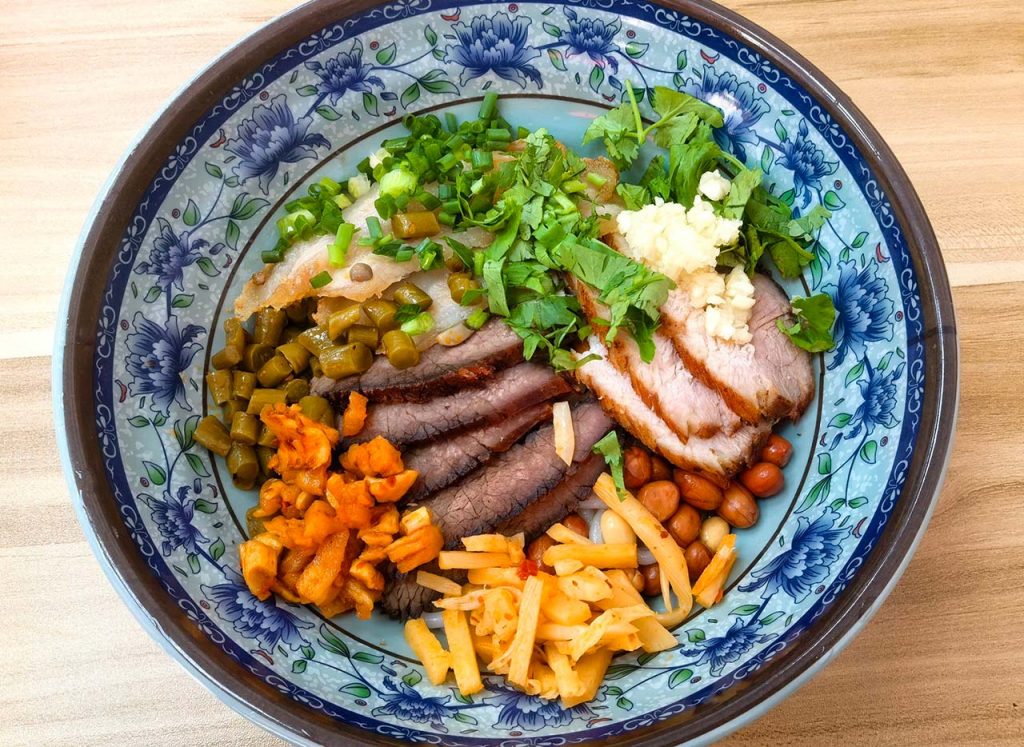 Guilin rice noodles mifen traditional breakfast dish with customizable toppings