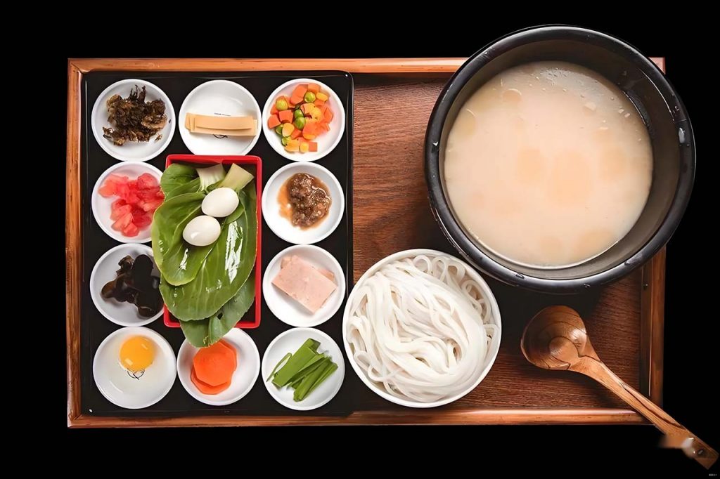 Yunnan crossing the bridge noodles guoqiao mixian with raw ingredients for cooking